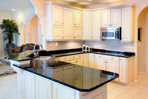 White cabinets with dark granite