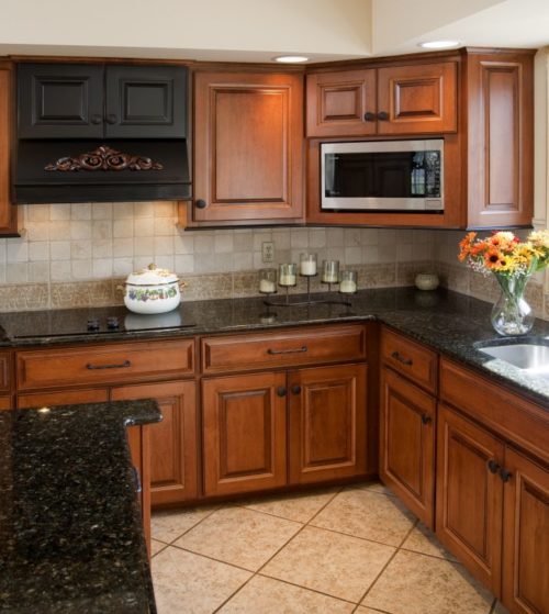 grey granite countertops with brown cabinets