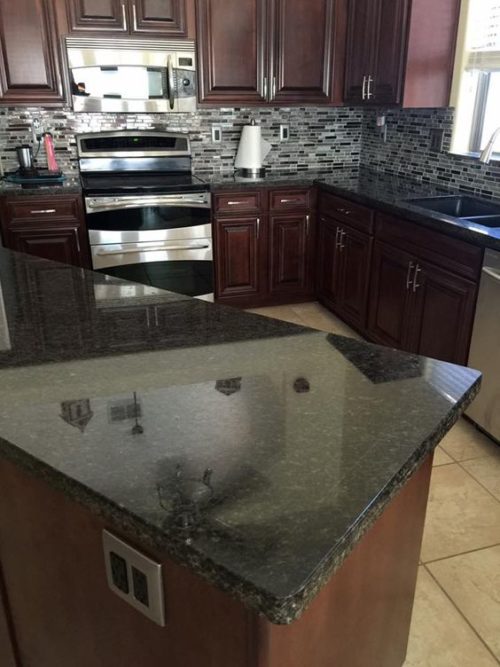 grey granite countertops with brown cabinets