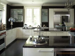 Dark granite countertops with white cabinets