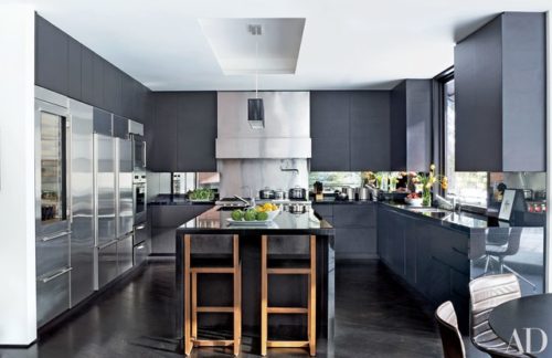 Gray cabinets with dark black countertops