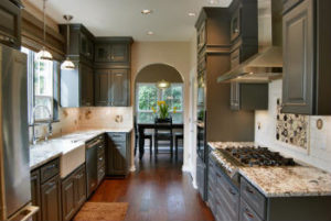 Eclectic kitchen with mosaic on neutral backsplash